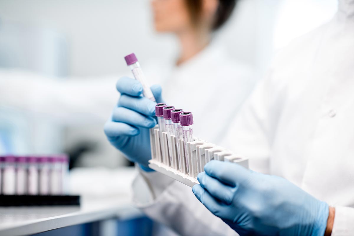 laboratory setting with scientist holding vials