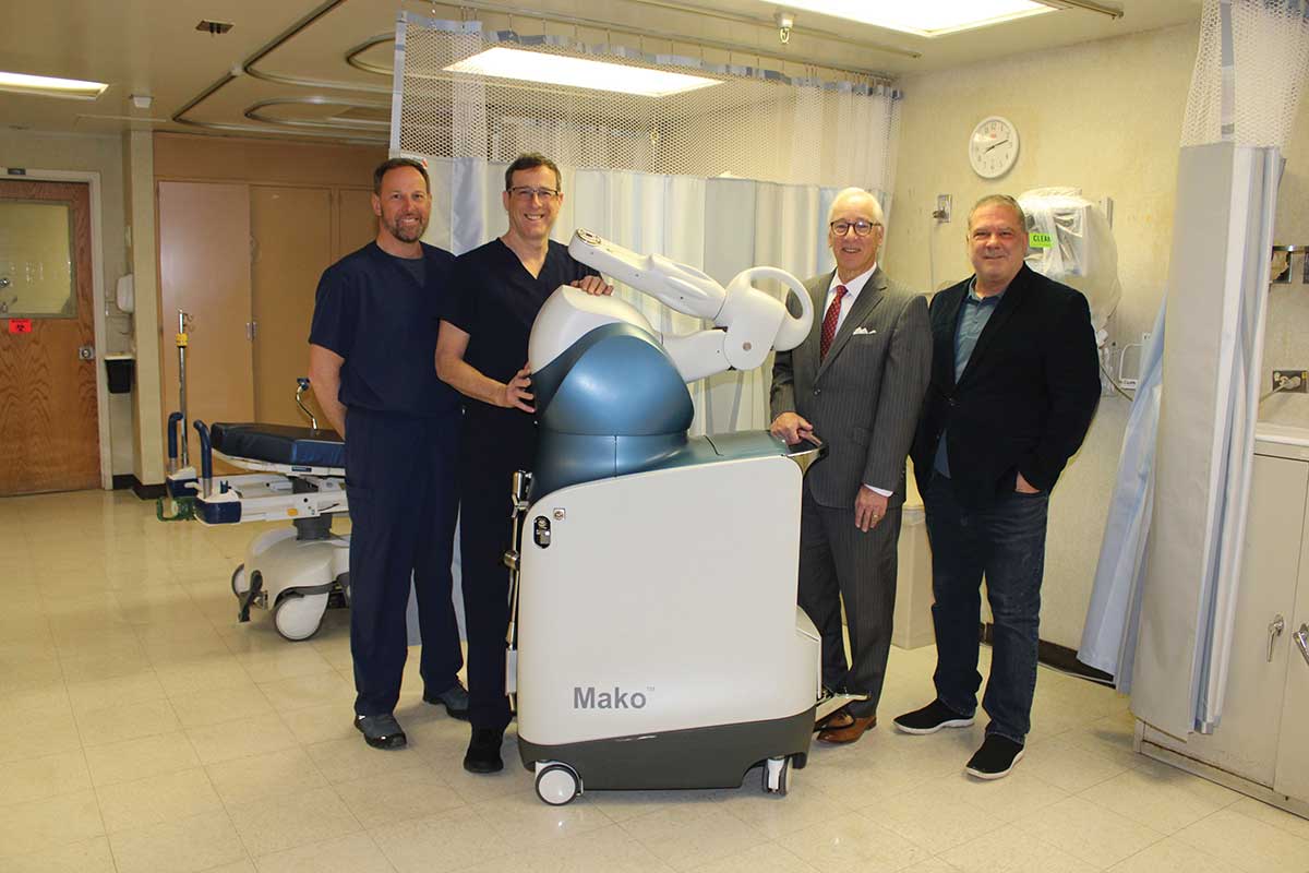 doctors and hospital administrators promote robotic surgery