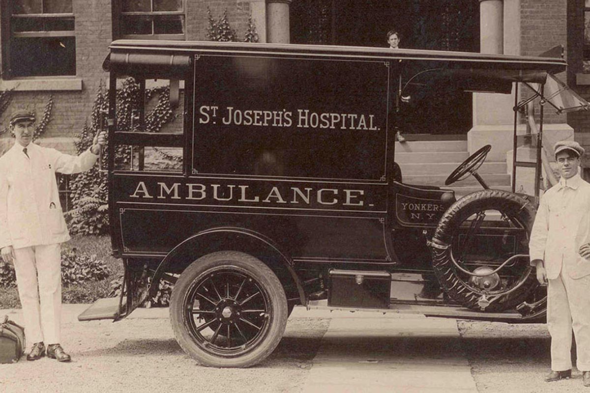 SJMC historical photo of an ambulance, doctor, and driver